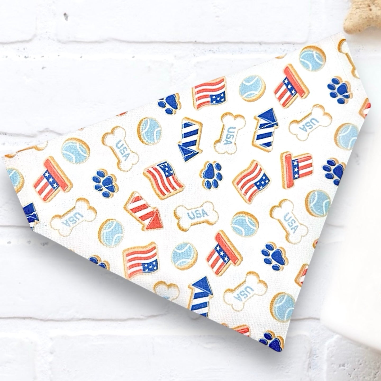 Fourth of July Dog Bandana for Independence Day in red white and blue flags, paw prints and patriotic hats.