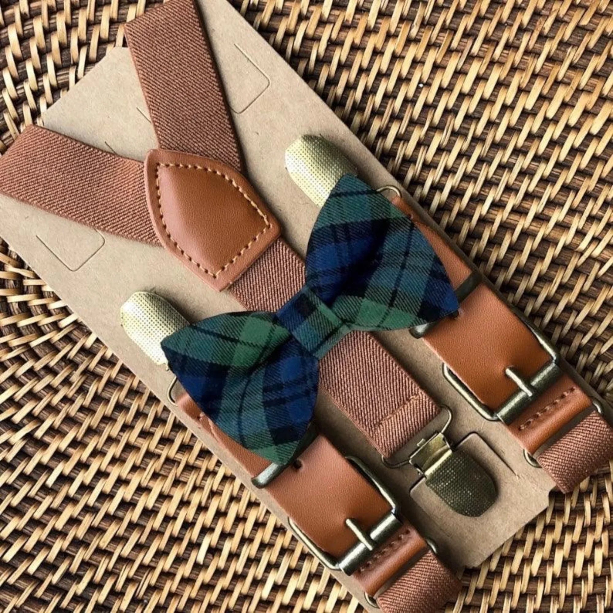 Navy and green bow tie and suspenders.