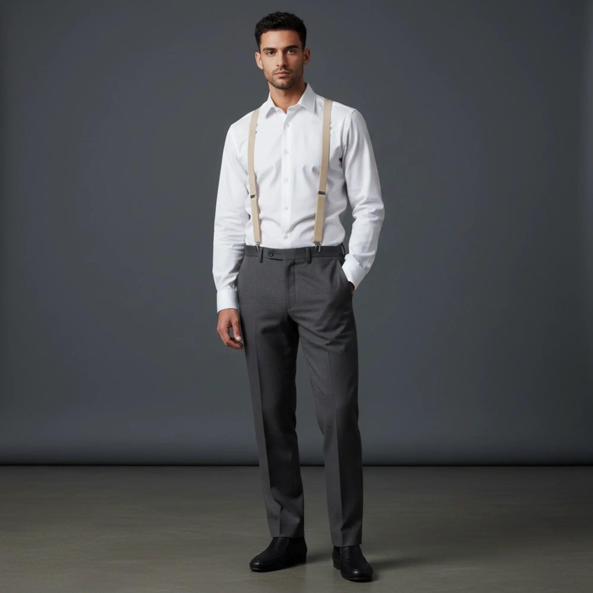 Groomsman wearing a white shirt, gray pants, and suspenders in a wedding.