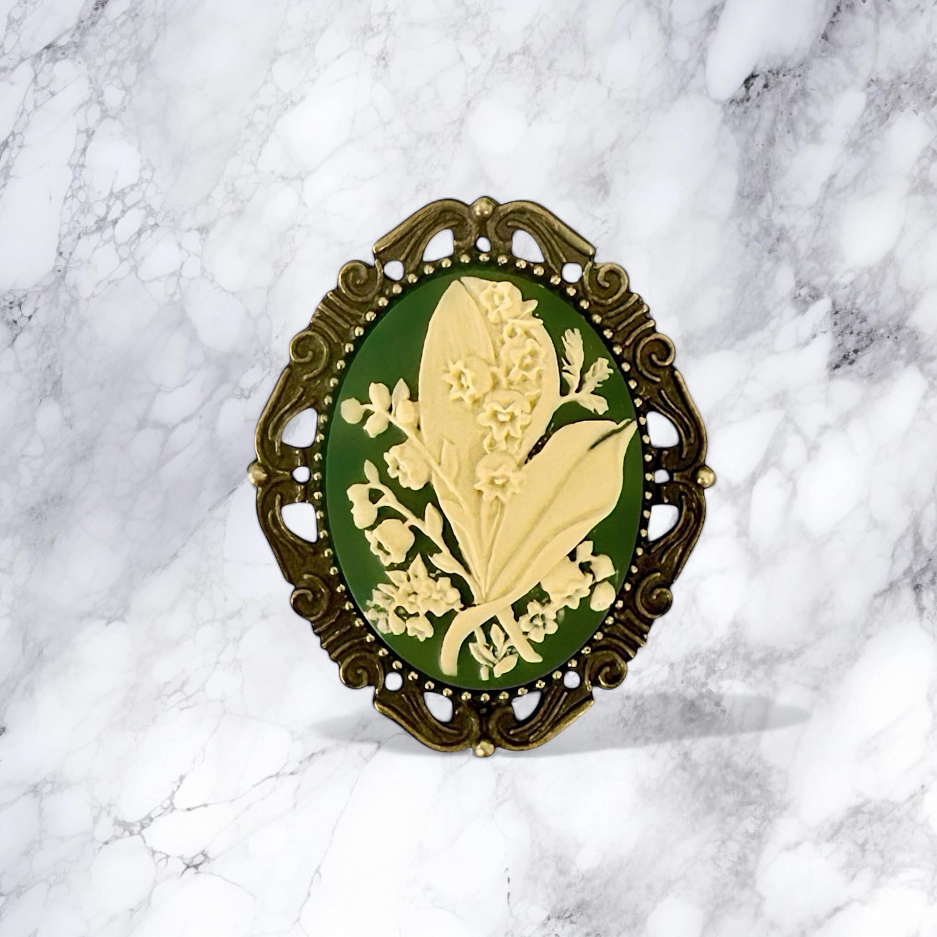 Decorative brooch with floral design on a marble background