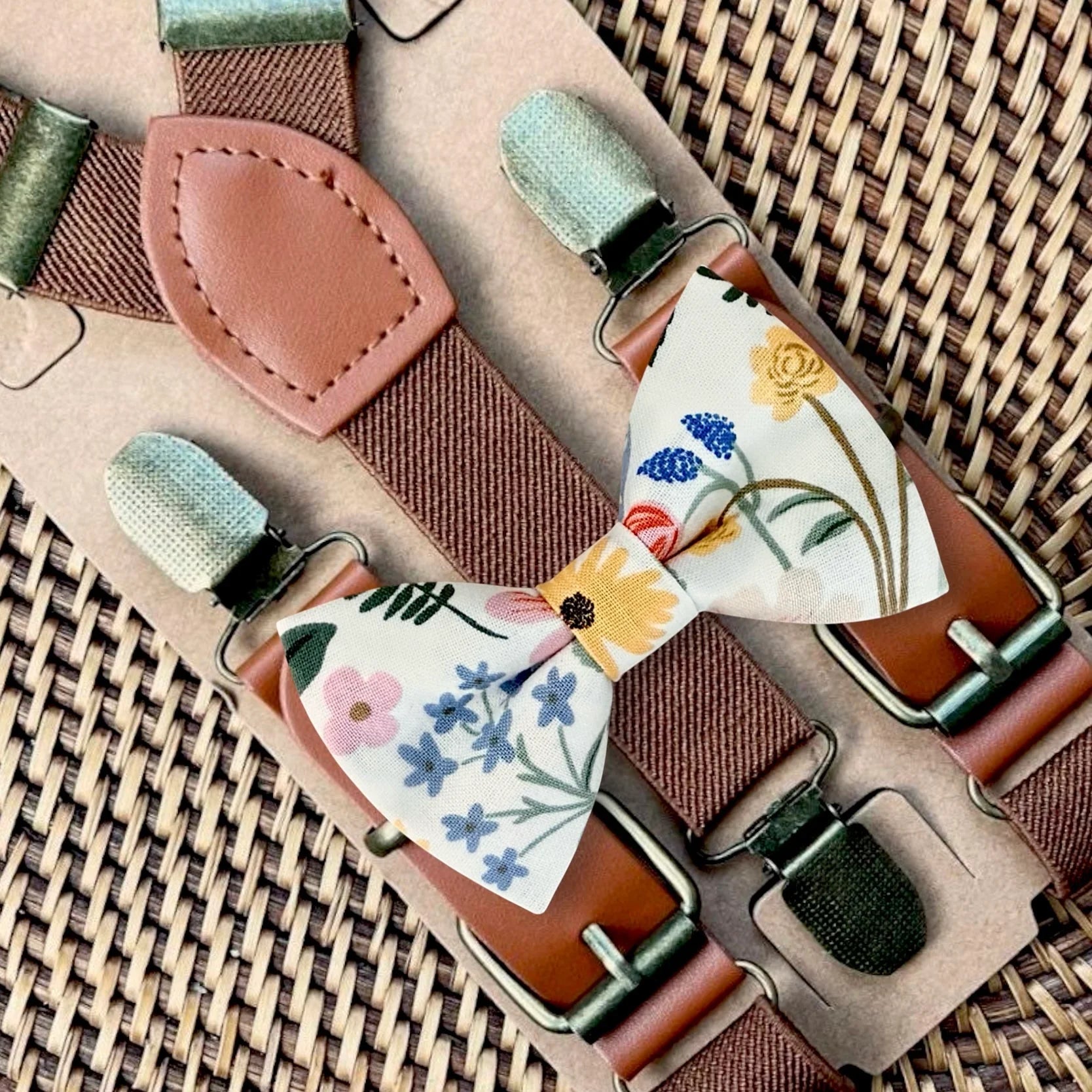 Garden floral bow tie with yellow fabric and colorful blooms paired with dark brown suspenders