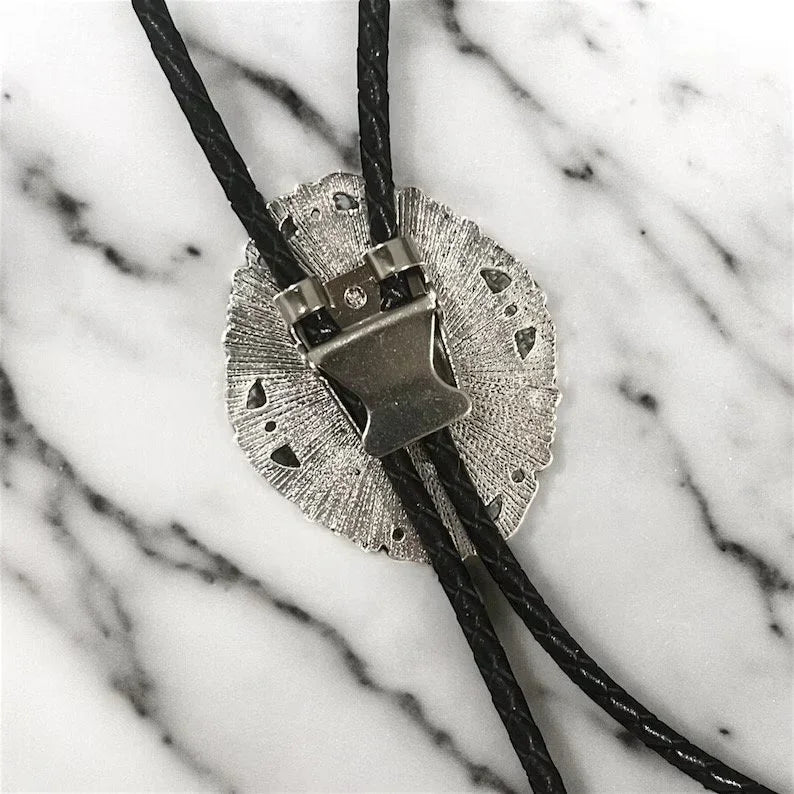 Silver bolo clasp on black leather cord