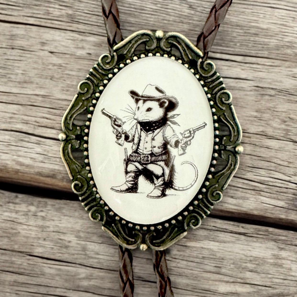 Opossum bolo tie with adjustable metal backing and secure cord — handmade western formal wear gift.