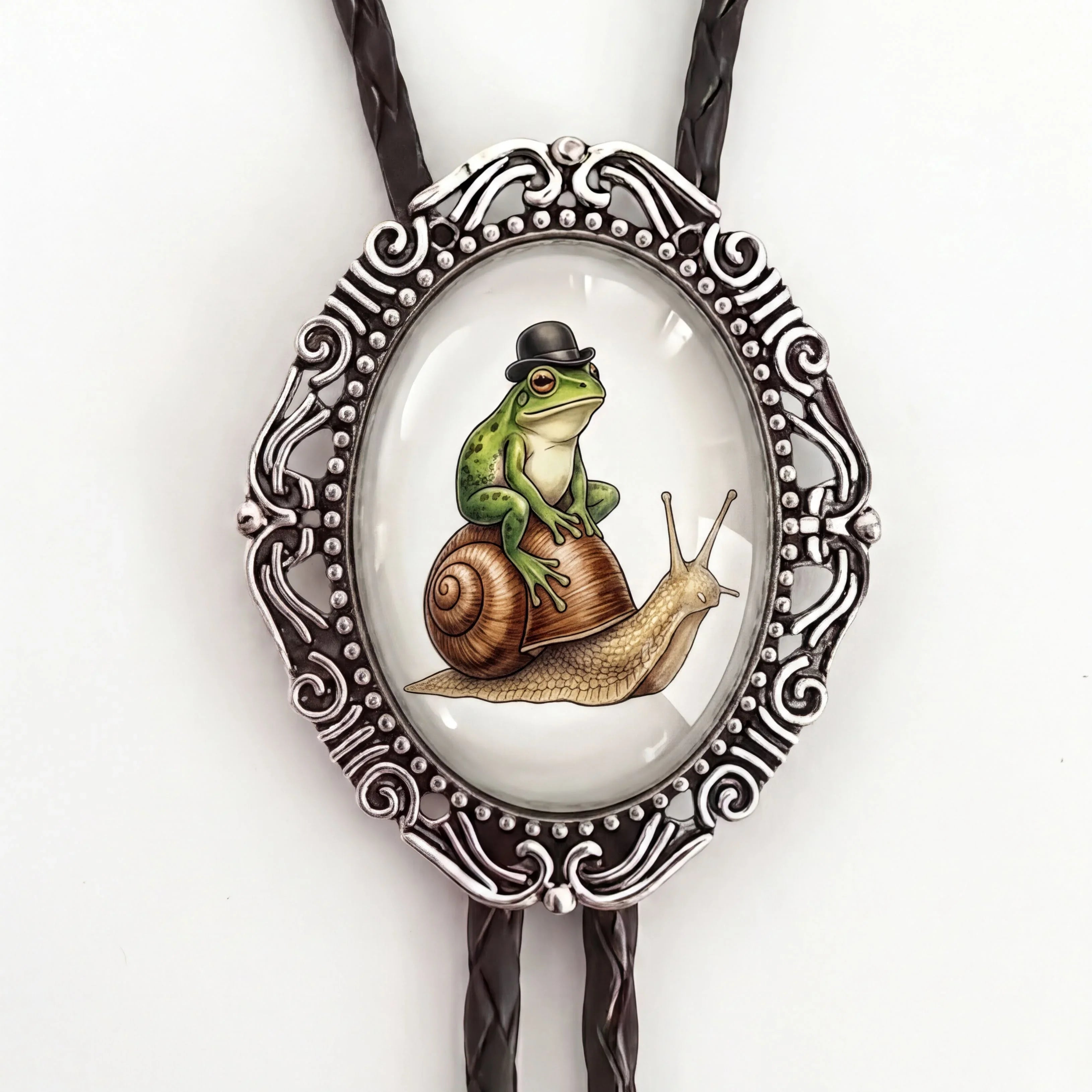Bolo tie with frog and snail in silver and black leather cord.