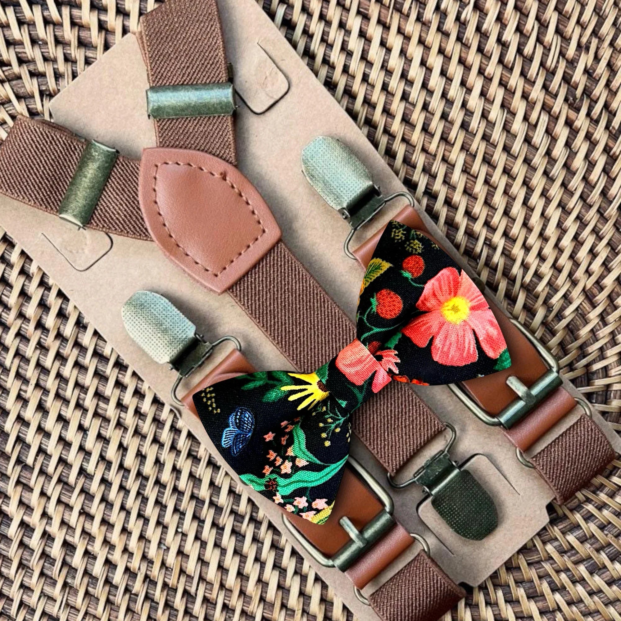 Black bow tie and suspenders with floral pattern