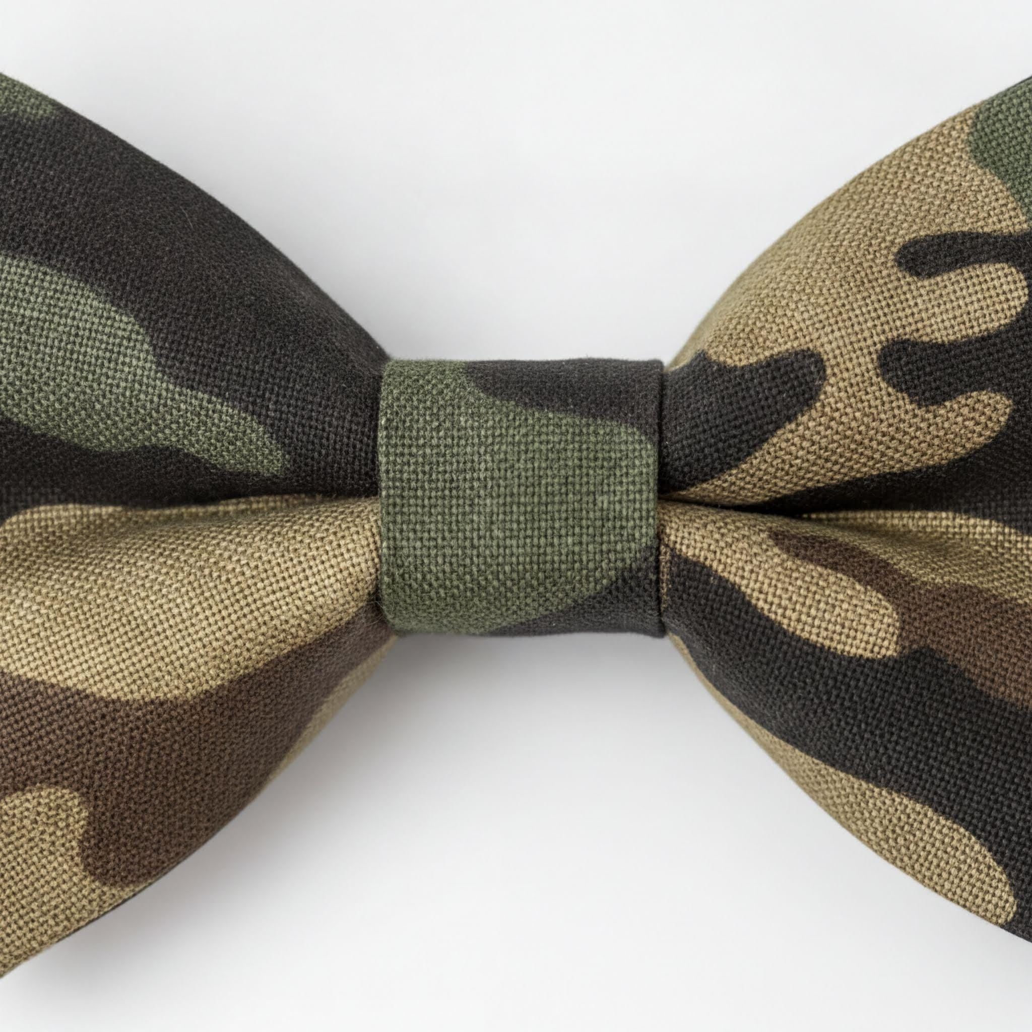 A camouflage bow tie with a dark green and beige pattern.