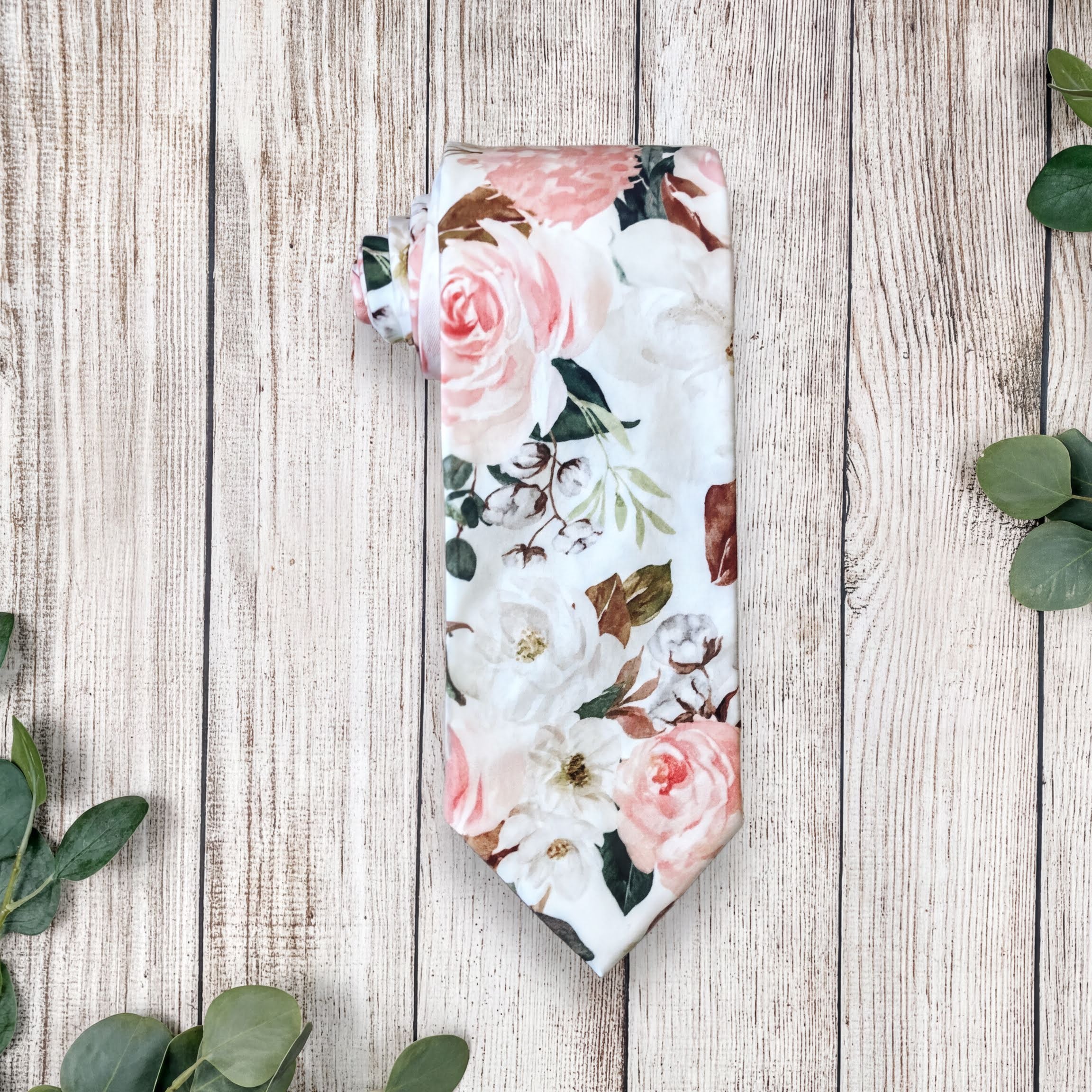 Blush and white floral men’s tie for wedding or special event.