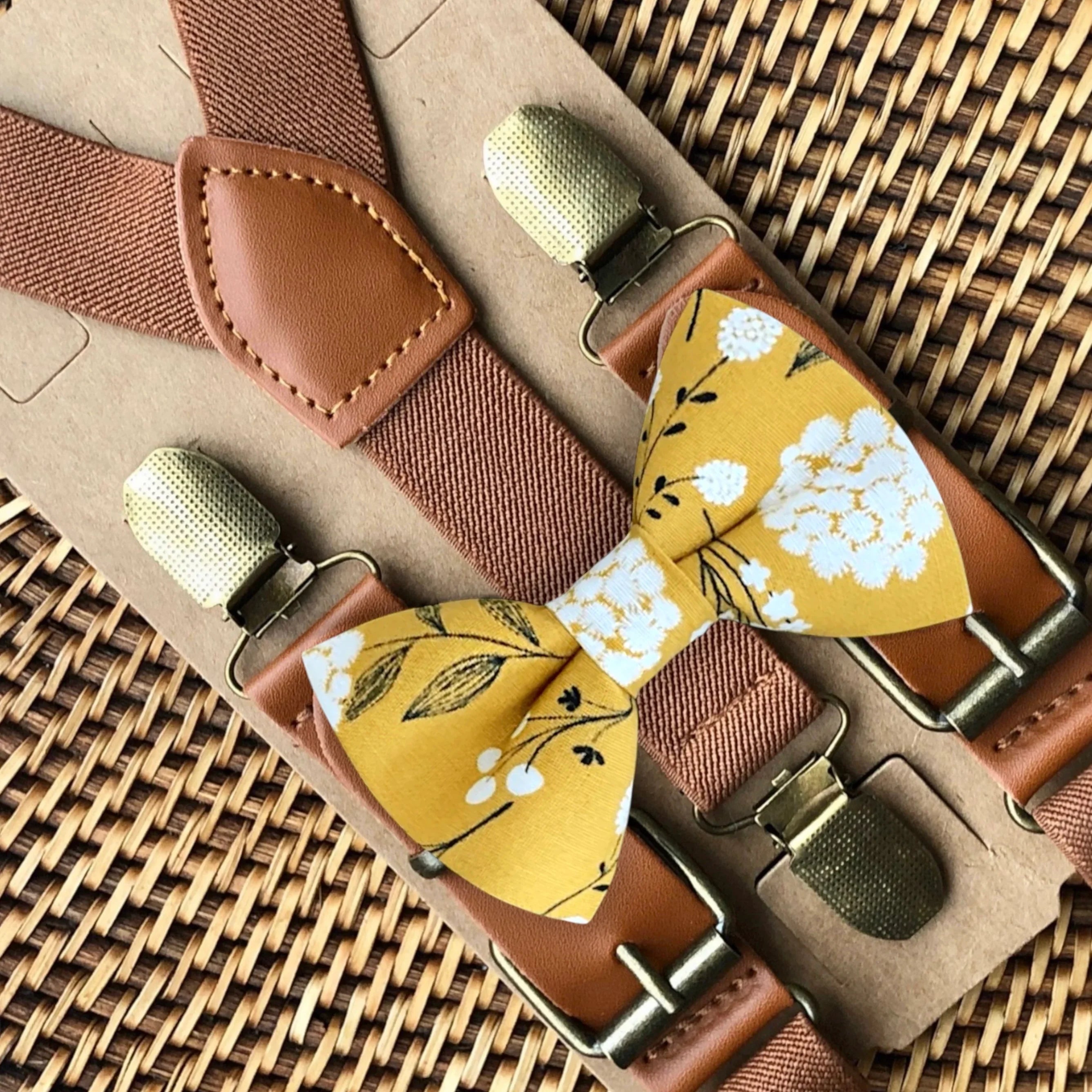 Mustard floral bow tie and suspenders for groomsmen and wedding.