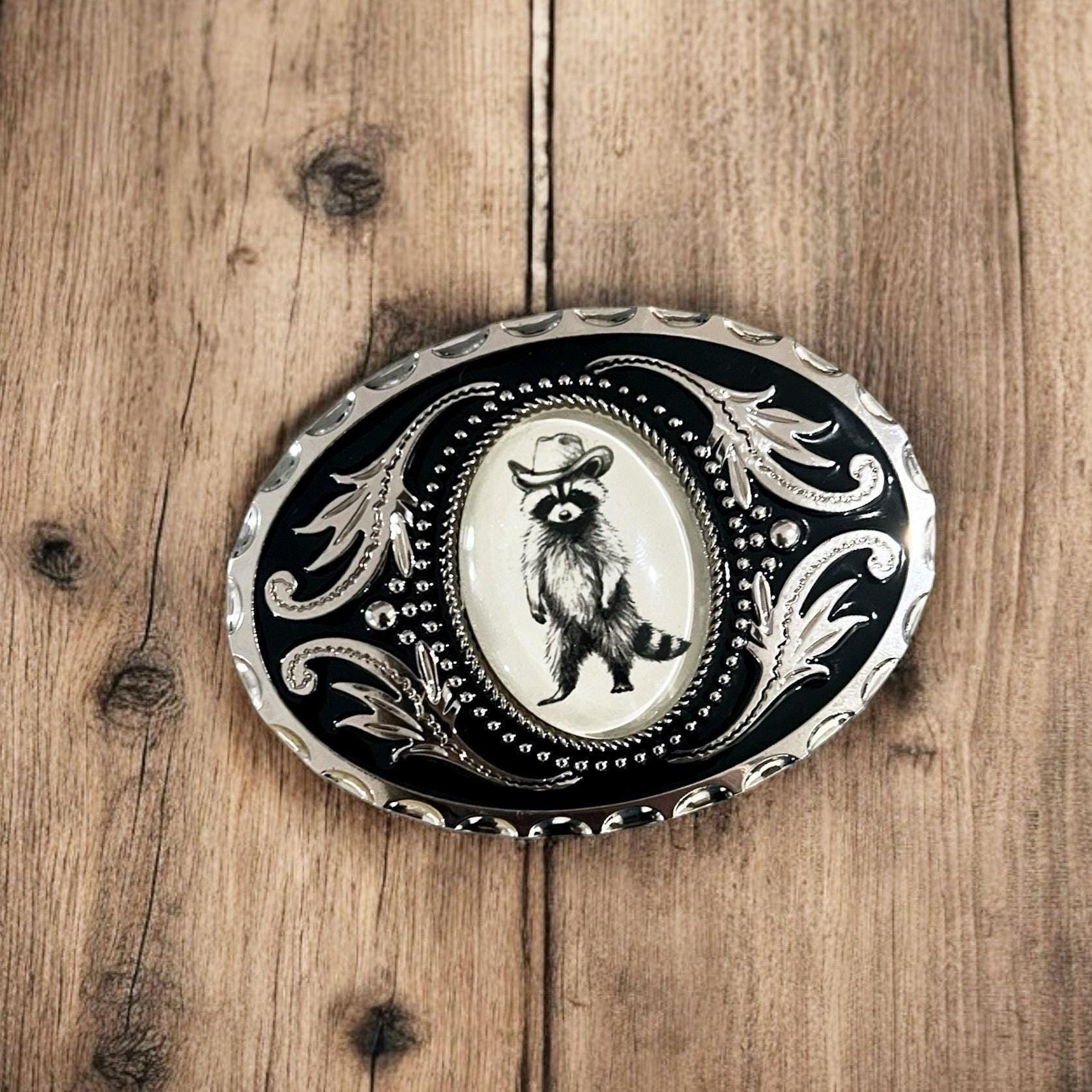 Belt Buckle with Cowboy Raccoon, Western Accessory on wood table