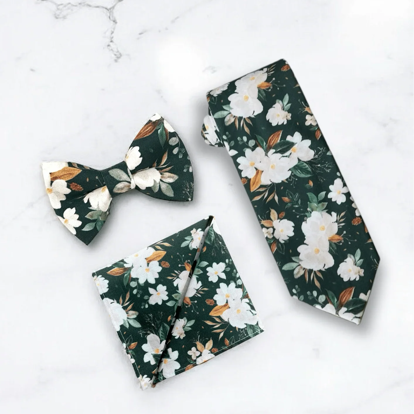 Emerald green floral men’s tie, bow tie and pocket square for wedding or special event.