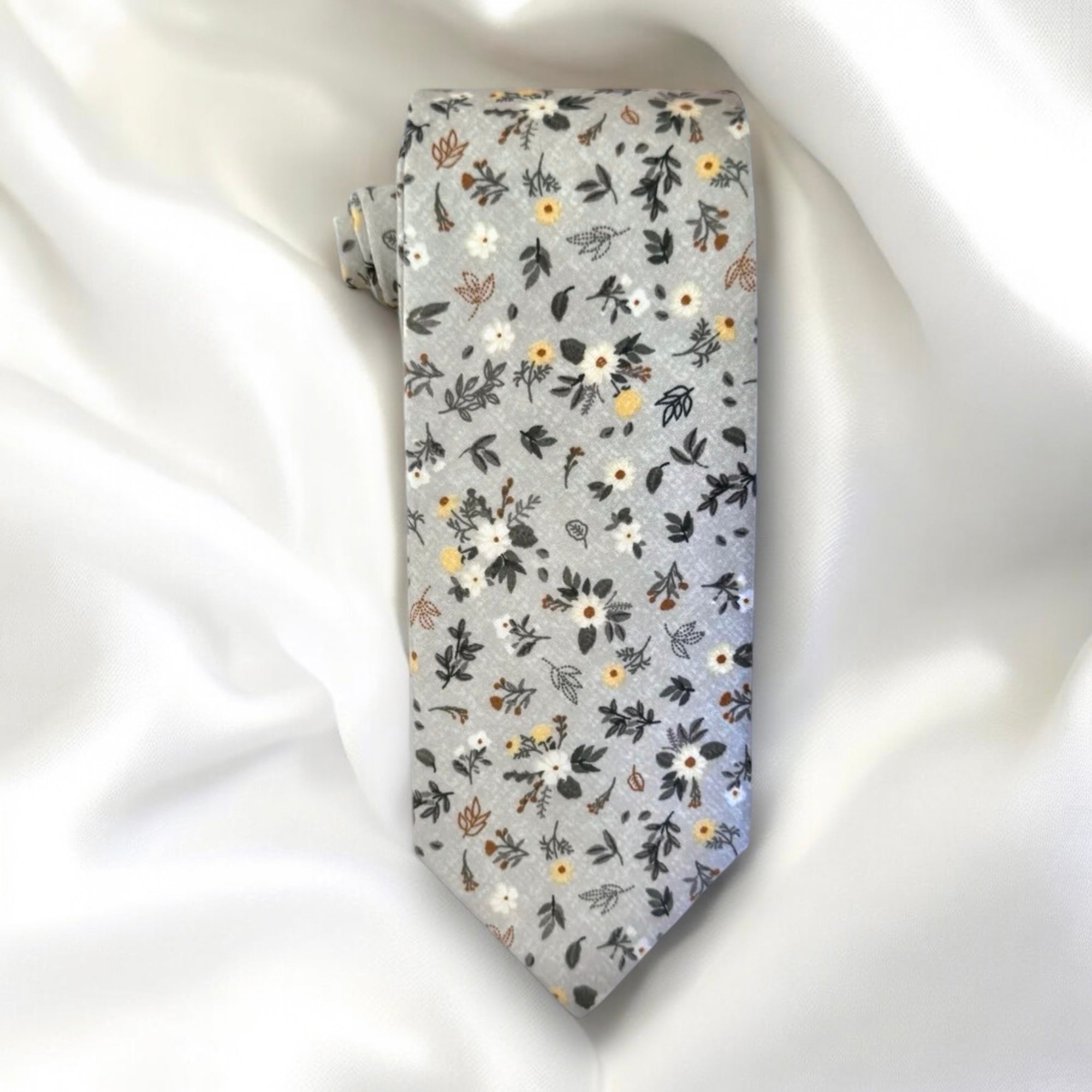 Light blue and white floral men’s tie for wedding.