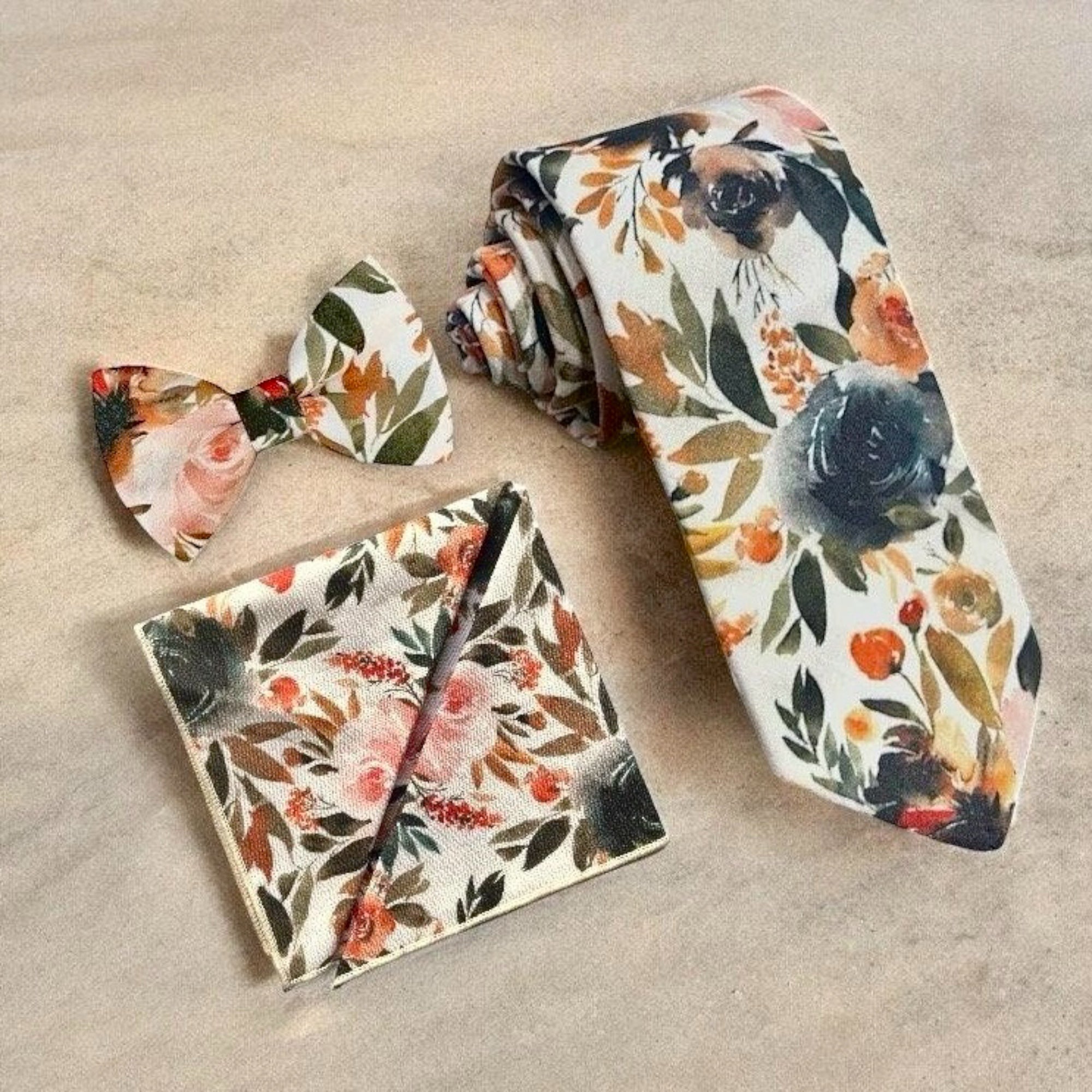 Ivory terracotta floral men’s tie, bow tie and pocket square for wedding or special event.