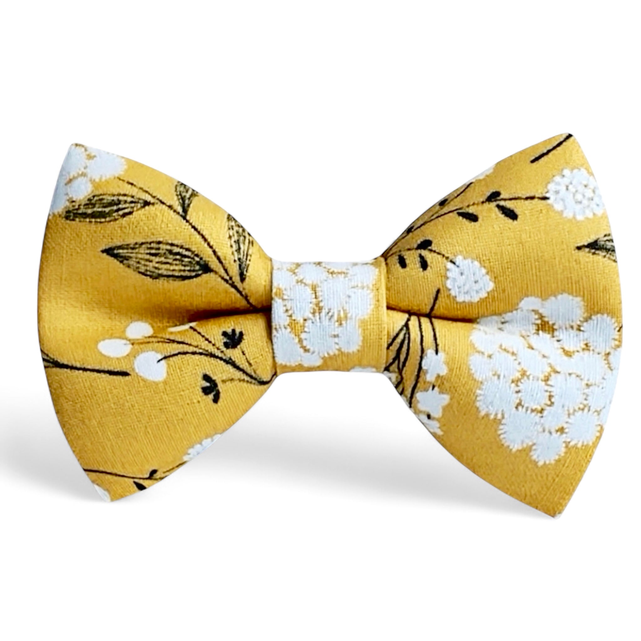 Yellow bow tie with floral pattern on a white background