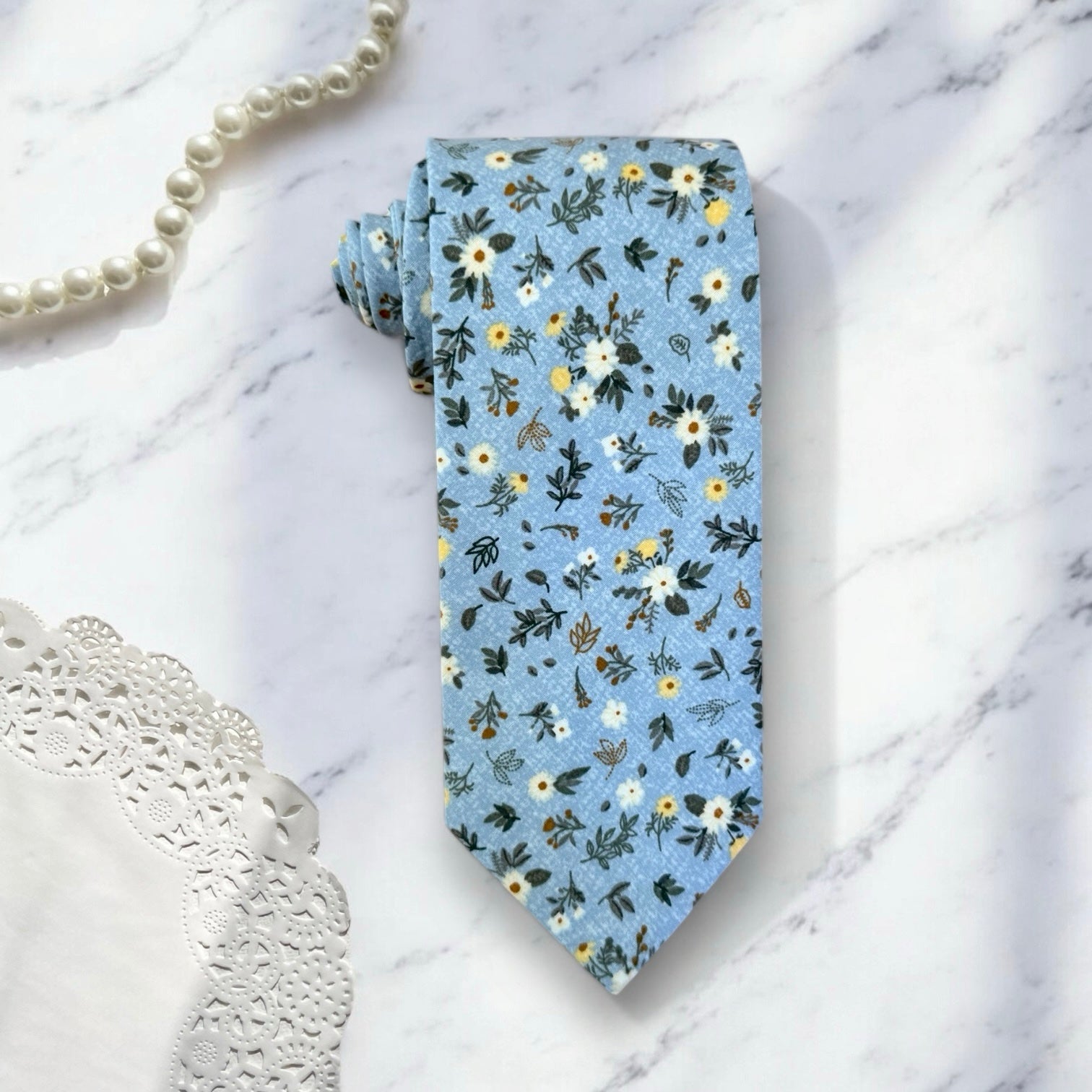 Blue and white floral men’s tie for wedding.