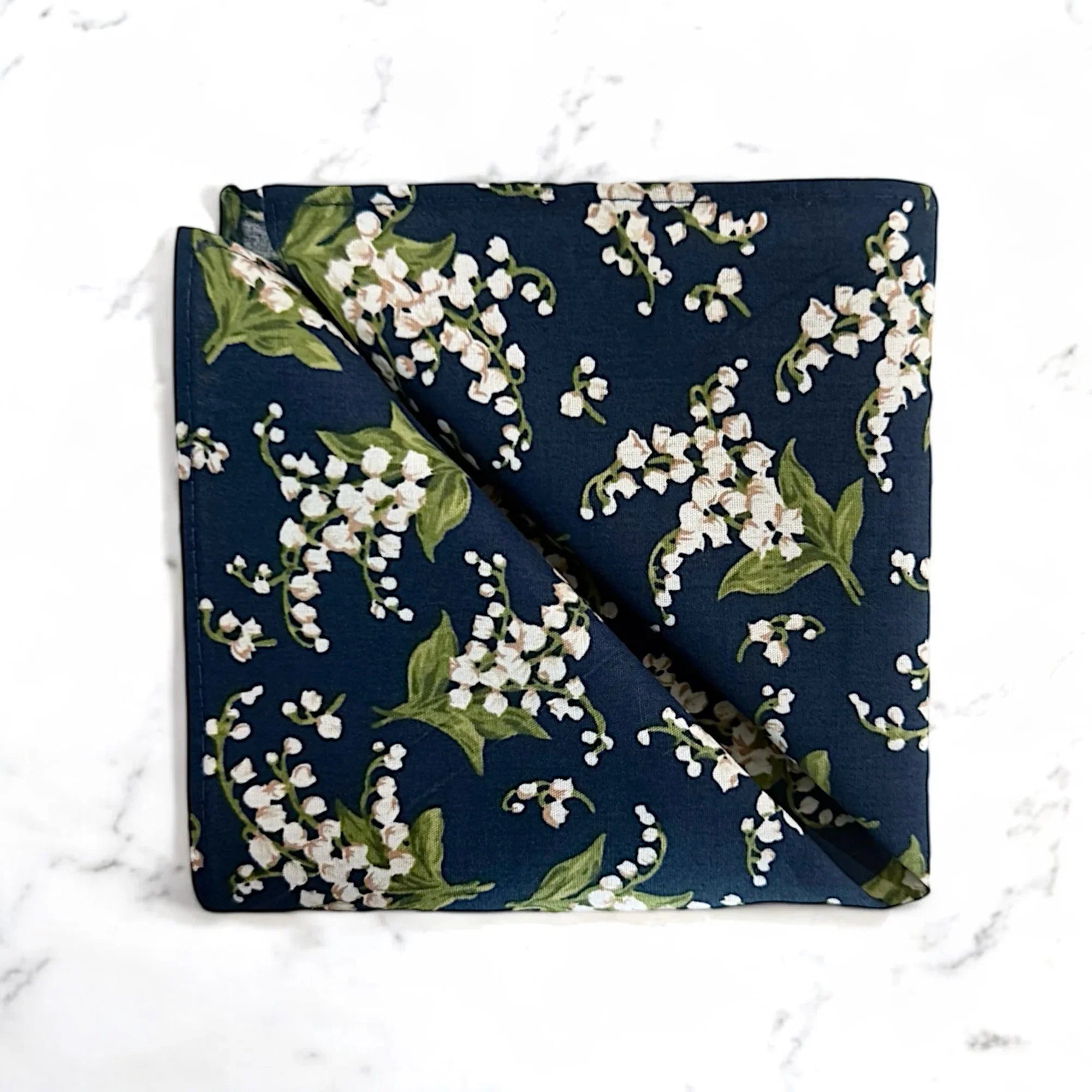 Navy blue floral pocket square for groomsmen and weddings.