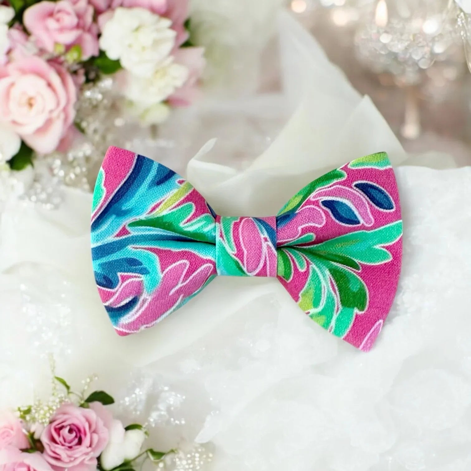 Pink bow tie with aqua accents for weddings and ring bearers.