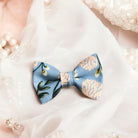 Dusty Blue Hydrangea Bow Tie for wedding party, groomsmen and ring bearers on lace background.