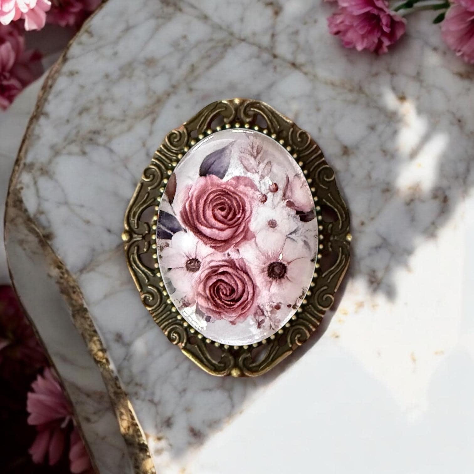 Vintage style bronze flower brooch pin featuring a highly detailed engraved floral design and antique finish jewelry details.
