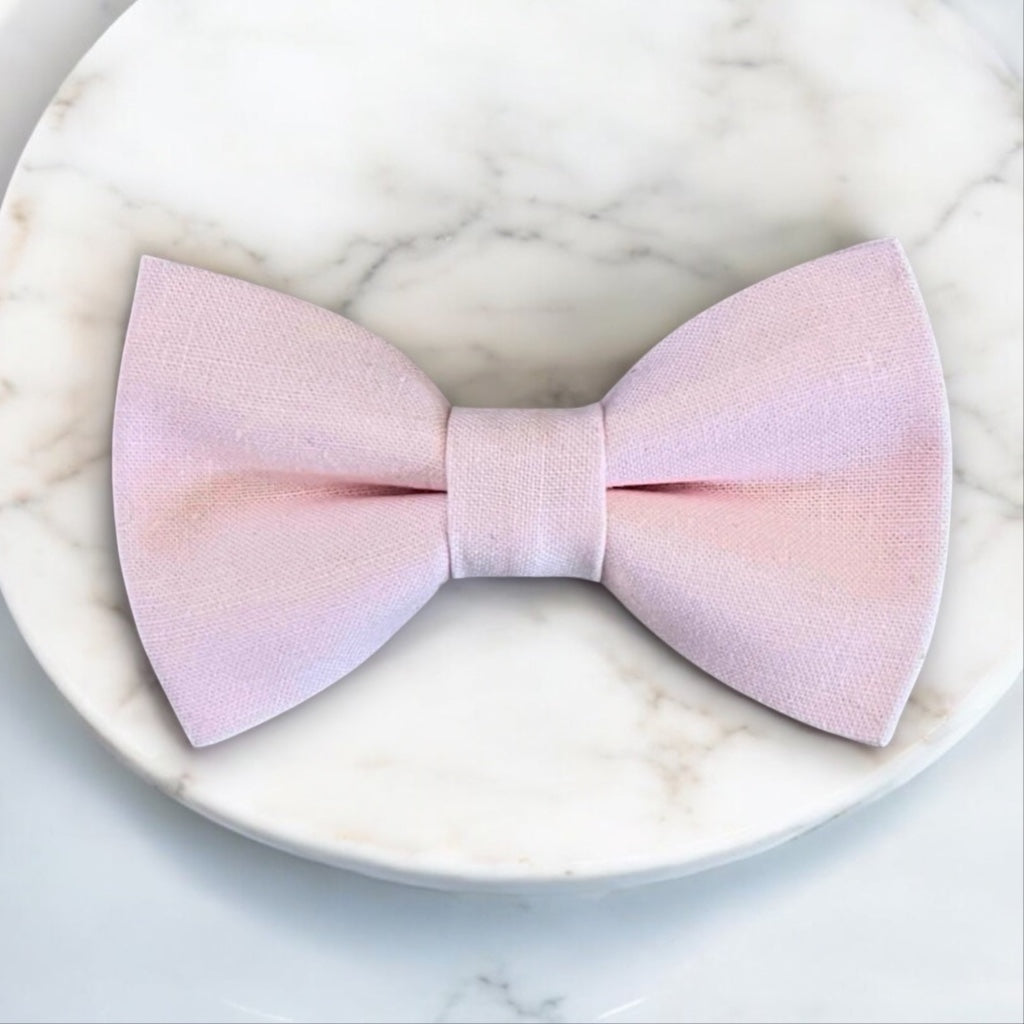 Light blush pink bow tie for a groomsman or ring bearer in a wedding.