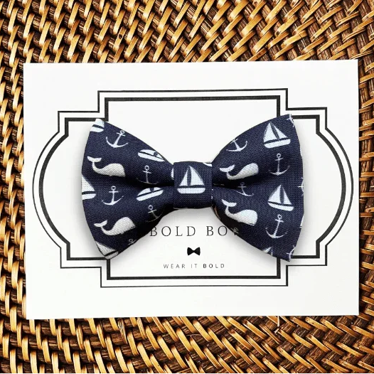 Dog bow tie size chart. Size Small is 3 1/2 inches wide for small dogs under 15 lbs. Size Medium is 4 inches wide for medium dogs between 15 band 40 lbs. Size Large is 4 1/2 inches wide for Large Dogs between 40 band 80 lbs. Size Extra Large is 5 1/2 inches wide for Extra Large Dogs over 80 lbs. Sizing is up to preference and pet bow ties slide on to dog collars with elastic.