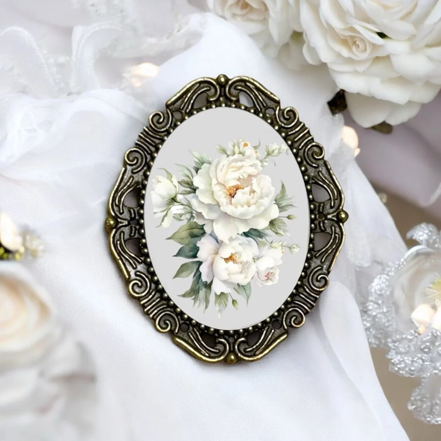 Decorative brooch with floral design on a white background