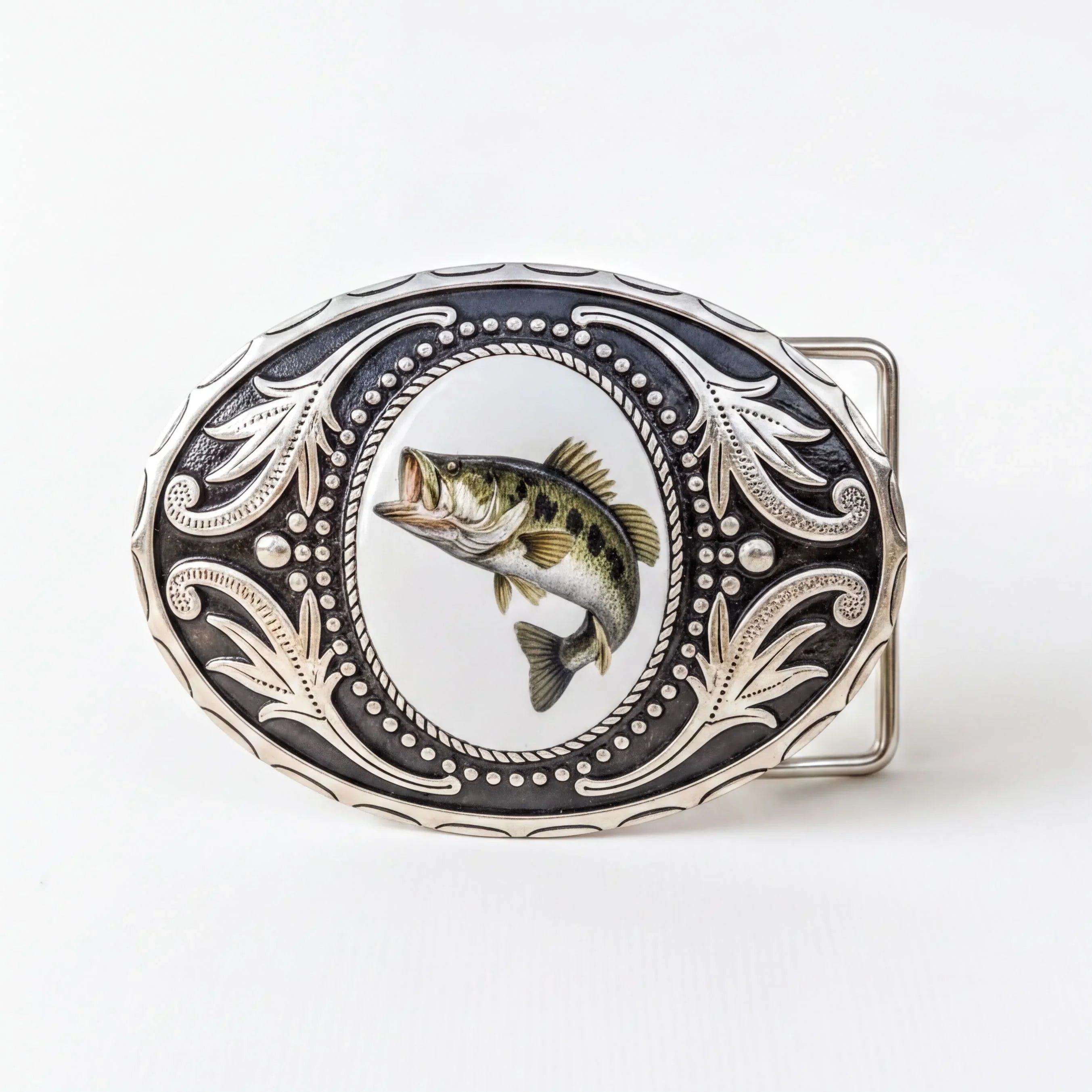 A decorative metal buckle with a fish image on it.
