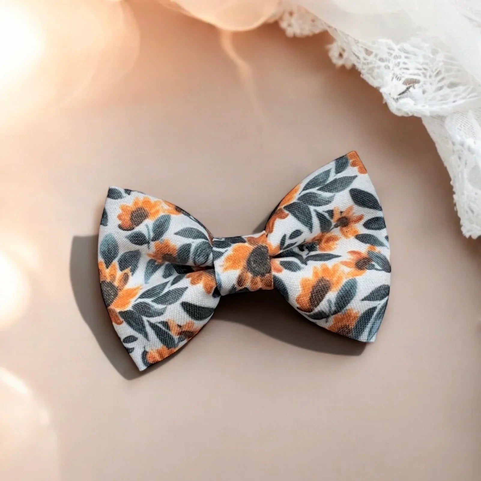 Size chart for pre-tied bow ties from The Bold Bow Tie detailing measurements across three sizes. Small is 3.5 inches wide and recommended for ages 6 months to 5 years. Medium is 4 inches wide and recommended for ages 6 to 12 years. Large is 4.5 inches wide and recommended for ages 13 years and up. Visual icons illustrate the relative sizes with horizontal arrows showing that width is measured from wingtip to wingtip. Bottom text notes that all bow ties are pre-tied and ready to add to your outfit.