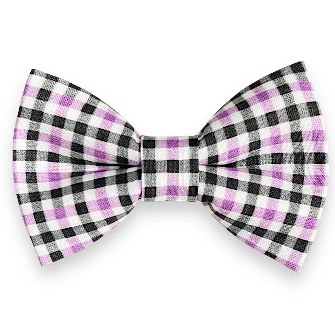 Checkered bow tie with black, white, and purple pattern on a white background
