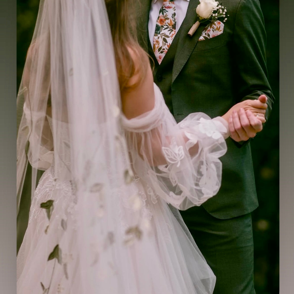 Bride and groom in floral tie for a wedding.