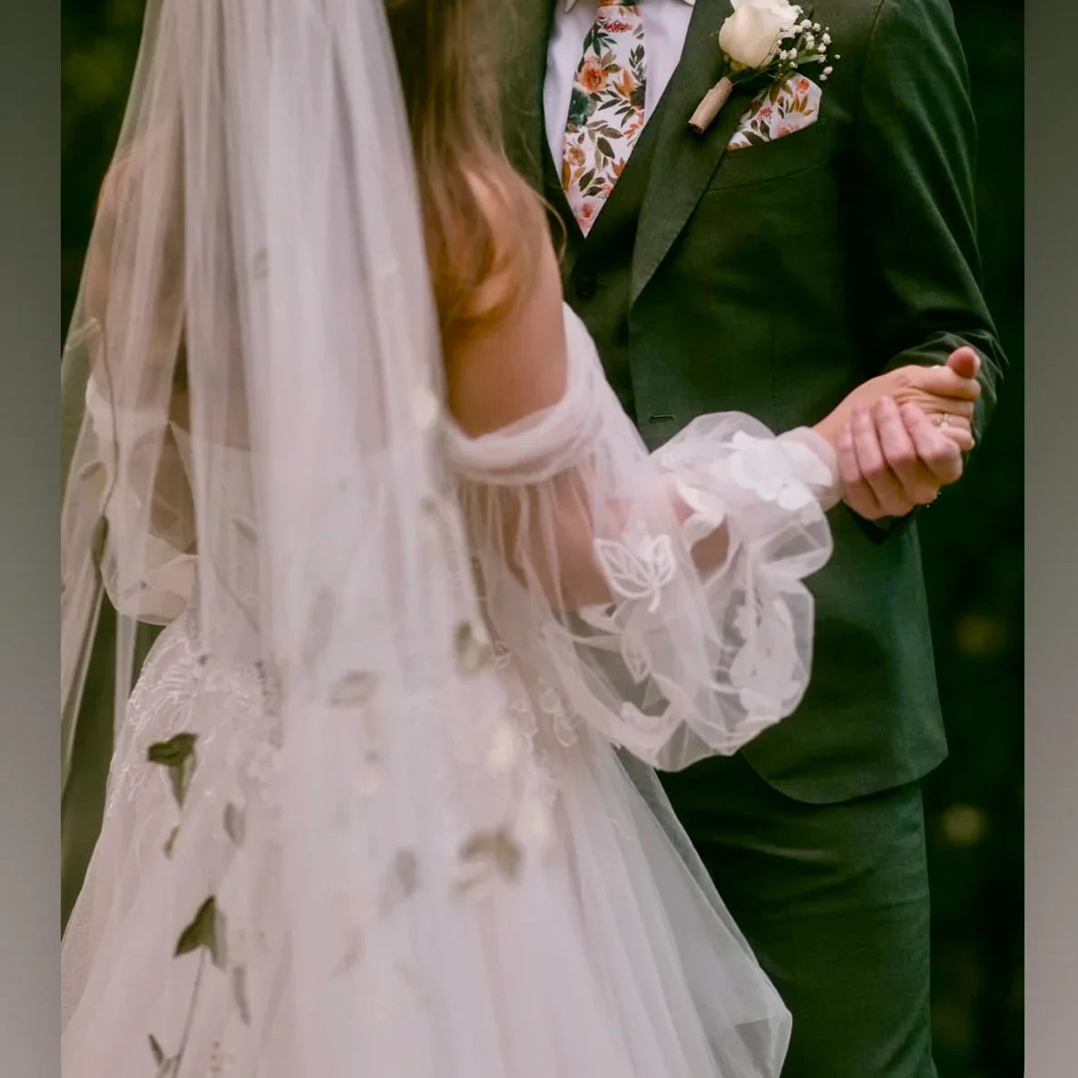 Bride and groom in floral tie for a wedding.