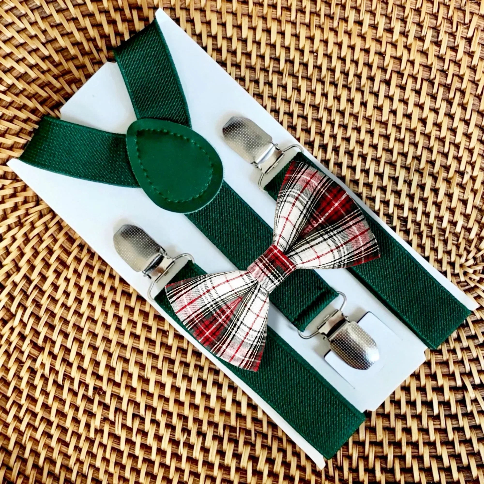 Plaid bow tie and suspenders in red and green for toddler Christmas outfit.