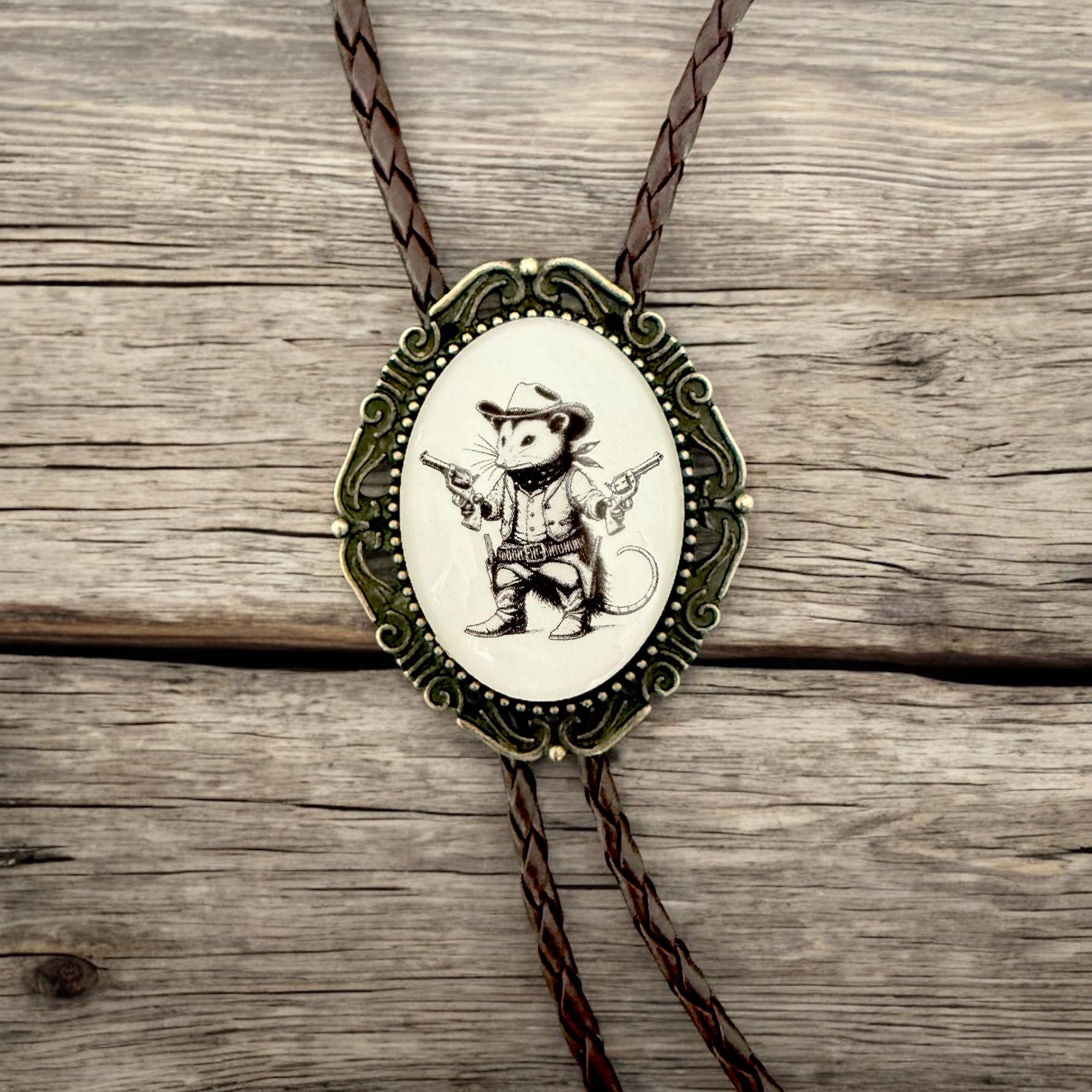 Handmade opossum bolo tie with glass-coated pendant — rustic western wedding and groomsmen accessory.