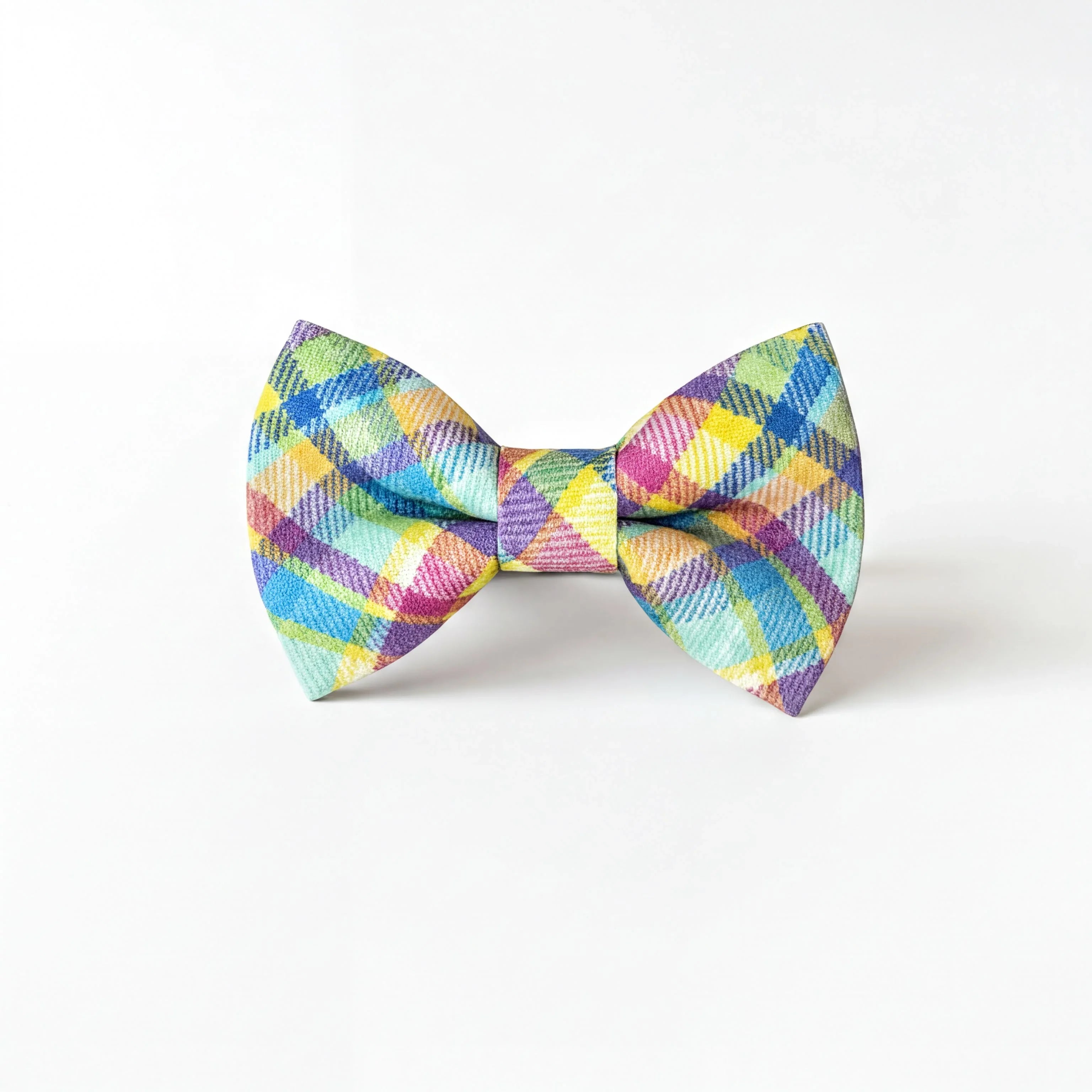 A colorful plaid bow tie is displayed against a white background.