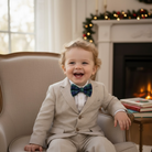 Toddler wearing a Christmas bowtie