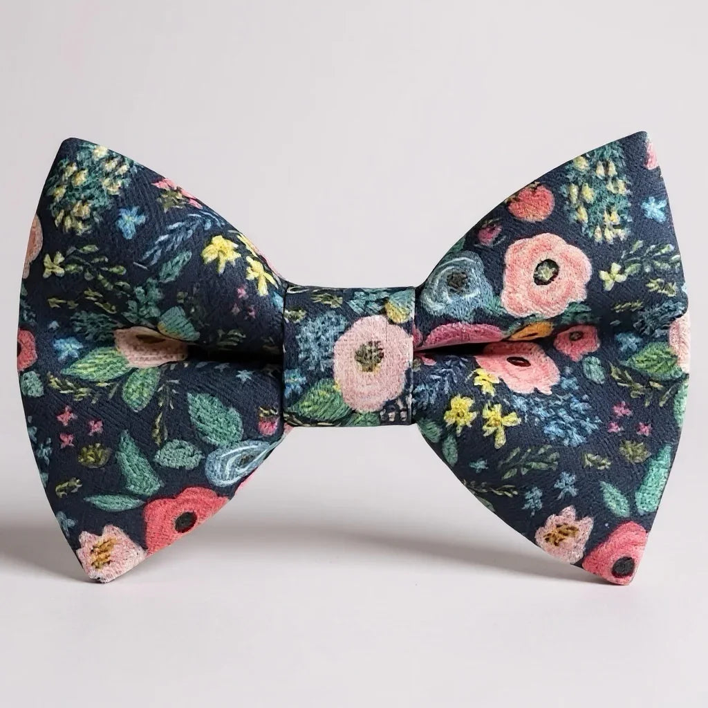 Navy Floral patterned bow tie on a light gray background