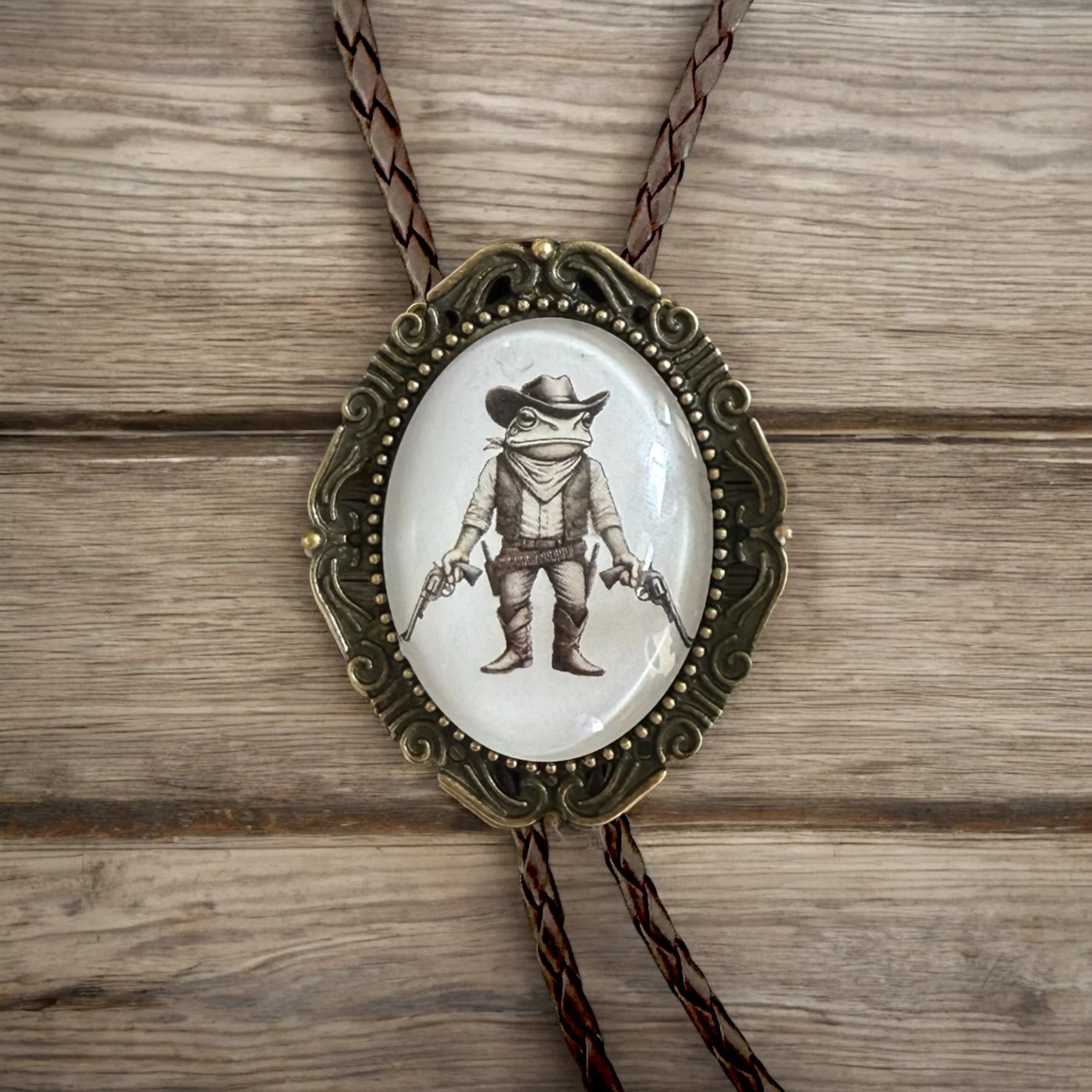 Handmade western bolo tie with shooting frog pendant — rustic country formal accessory.