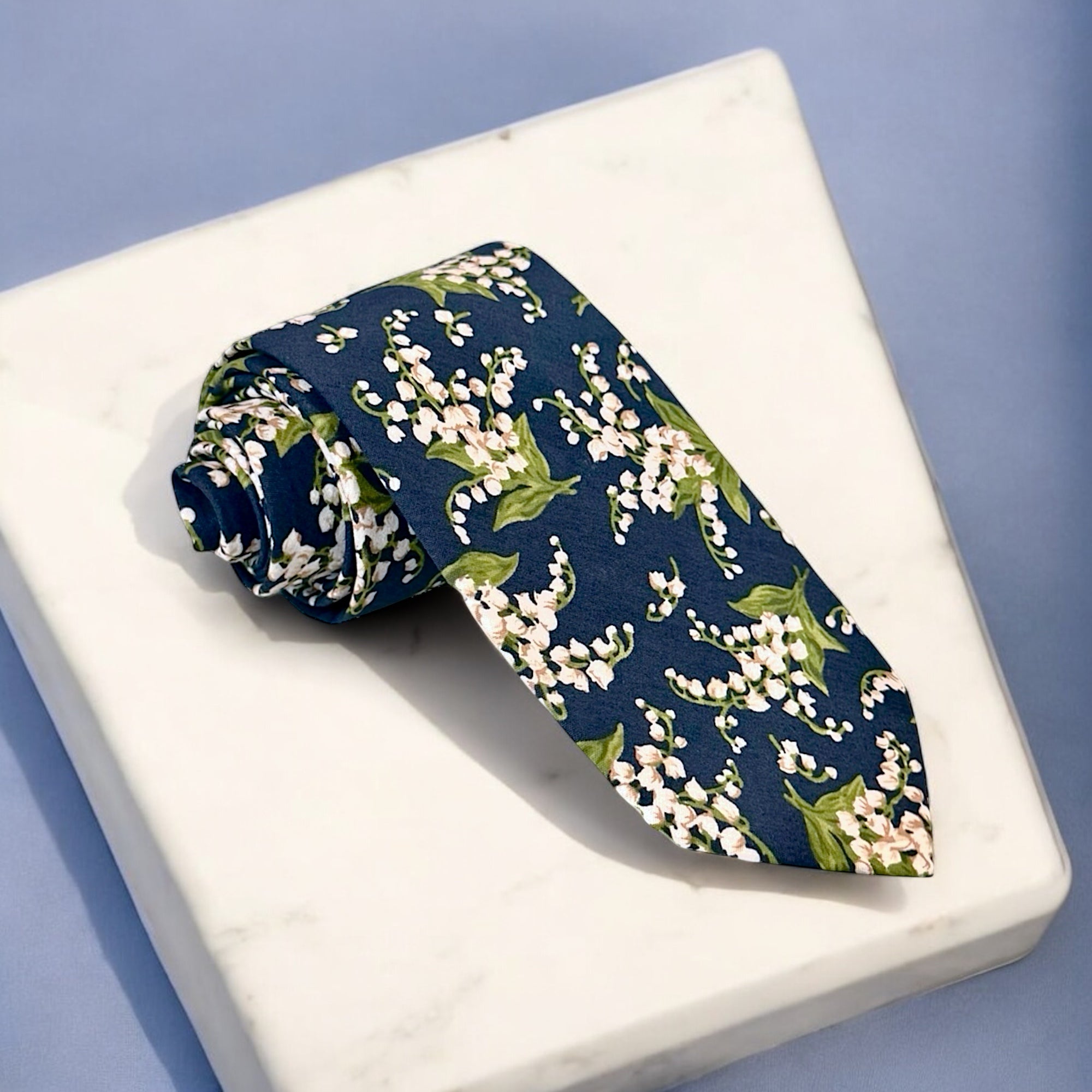 Navy and white floral men’s tie for wedding.