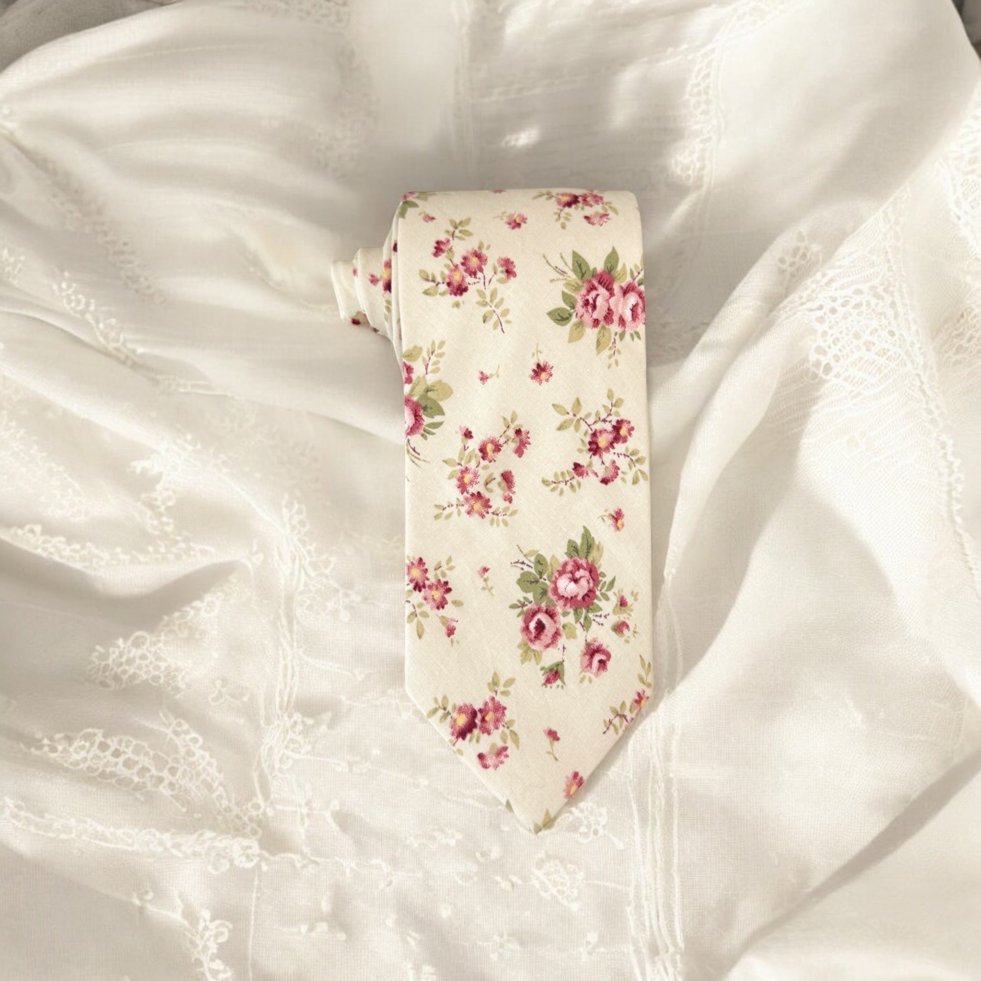Floral tie on a textured white fabric background