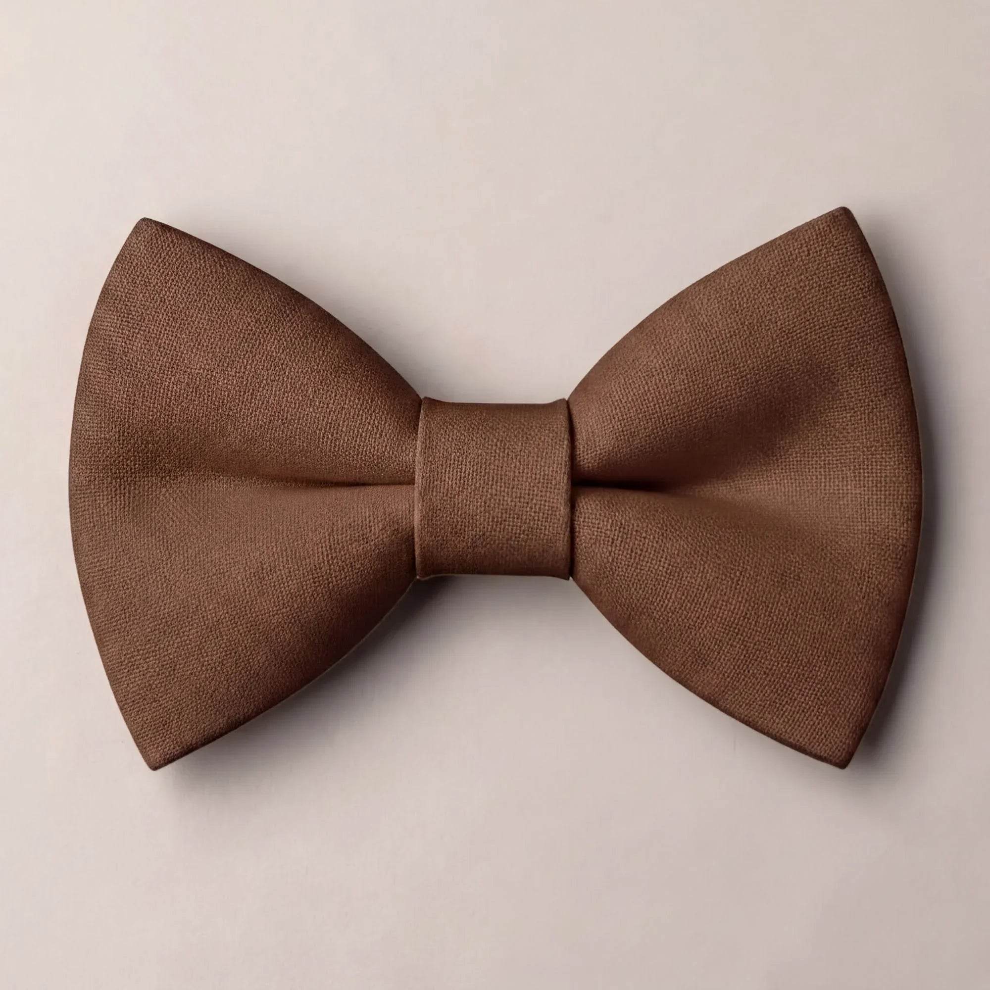 Solid chocolate brown formal groomsmen bow tie isolated on a white background