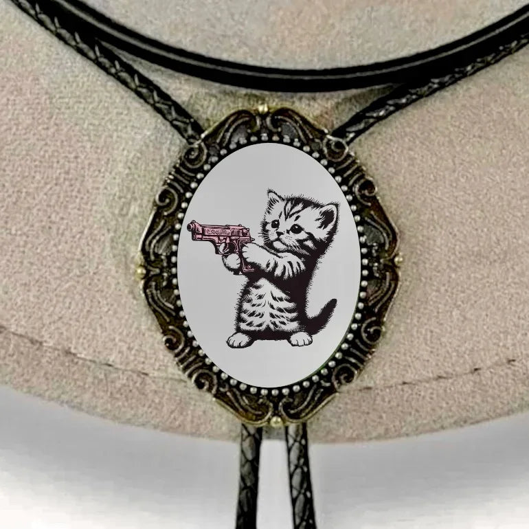 Bolo tie size chart from The Bold Bow Tie. The image displays a braided leather bolo tie with a round silver concho-style slide and silver metal tips, set against a multi-colored striped fabric background. A vertical dotted arrow on the right spans the full length of the piece, accompanied by text indicating a 39 inch cord length.
