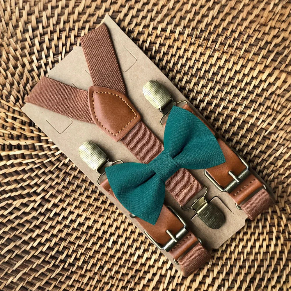 Size chart for suspender and bow tie sets from The Bold Bow Tie. X-Small (6mo-4yr): 15"-23" suspenders, 3.5" bow. Small (5-9yr): 18"-33" suspenders, 3.5" bow. Medium (10-12yr): 18"-33" suspenders, 4" bow. Adult (13yr-6'5"): 30"-53" suspenders, 4.5" bow. Big & Tall (Over 6'5"): 53"+ suspenders, 4.5" bow. Instructions note to measure from the back waistband over the shoulder to the front waistband for a comfortable fit.