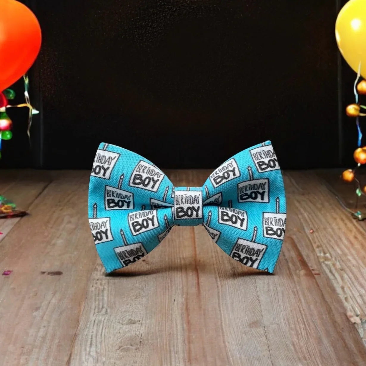 Size chart for pre-tied bow ties from The Bold Bow Tie detailing measurements across three sizes. Small is 3.5 inches wide and recommended for ages 6 months to 5 years. Medium is 4 inches wide and recommended for ages 6 to 12 years. Large is 4.5 inches wide and recommended for ages 13 years and up. Visual icons illustrate the relative sizes with horizontal arrows showing that width is measured from wingtip to wingtip. Bottom text notes that all bow ties are pre-tied and ready to add to your outfit.