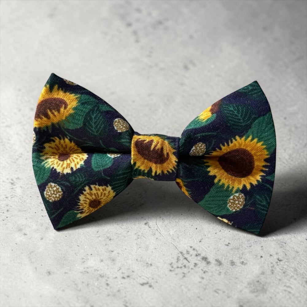 Floral Bow Tie for Men in Sunflower on concrete table