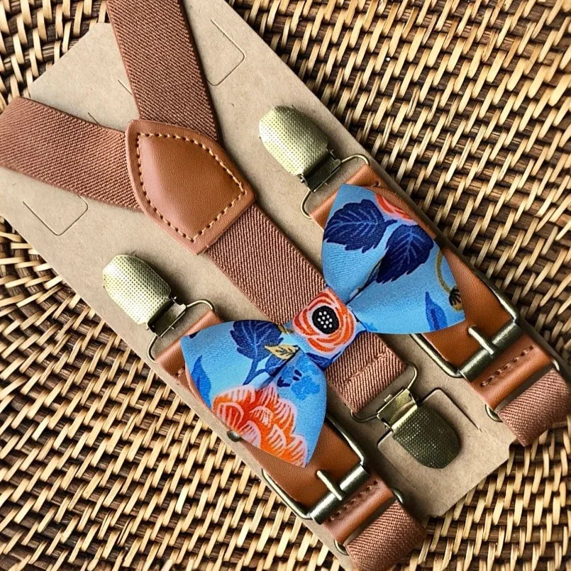 Blue and coral floral bow tie with brown suspenders displayed together