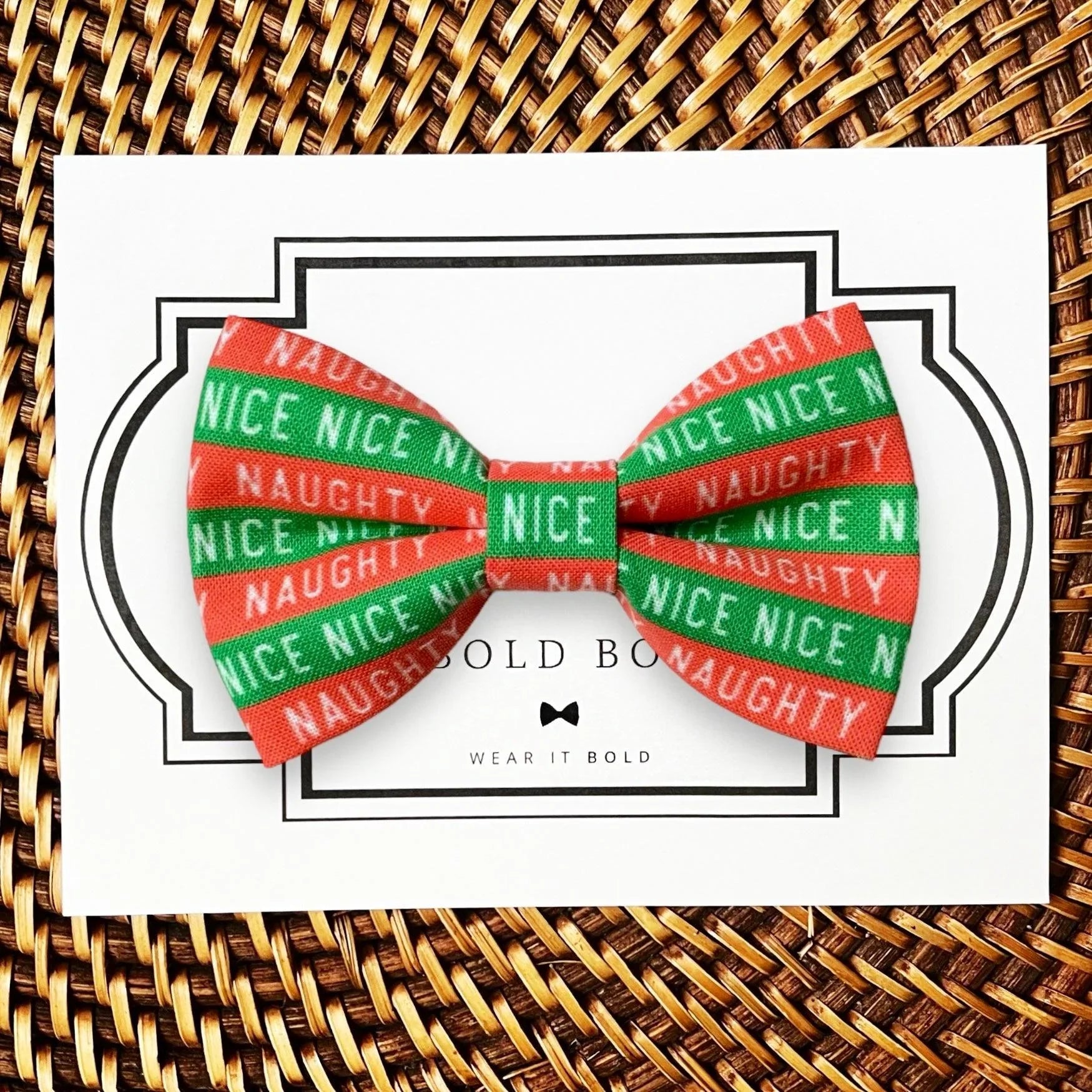 Naughty or Nice bow tie for dog and cat collars in red and green stripes displayed on a white card