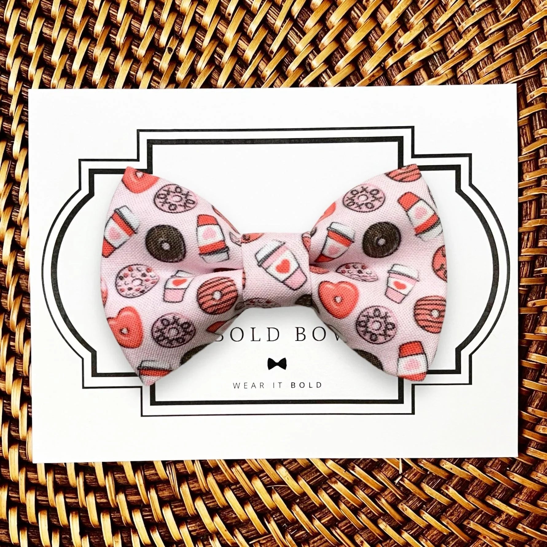 Product graphic showcasing the back of a pre-tied bow tie in a red and black buffalo plaid pattern, resting on a rustic wood surface. Two black elastic loops are attached to the center knot to slide onto a pet collar. Overlay text reads: Back of Bow Tie (may not be actual bow tie in listing).