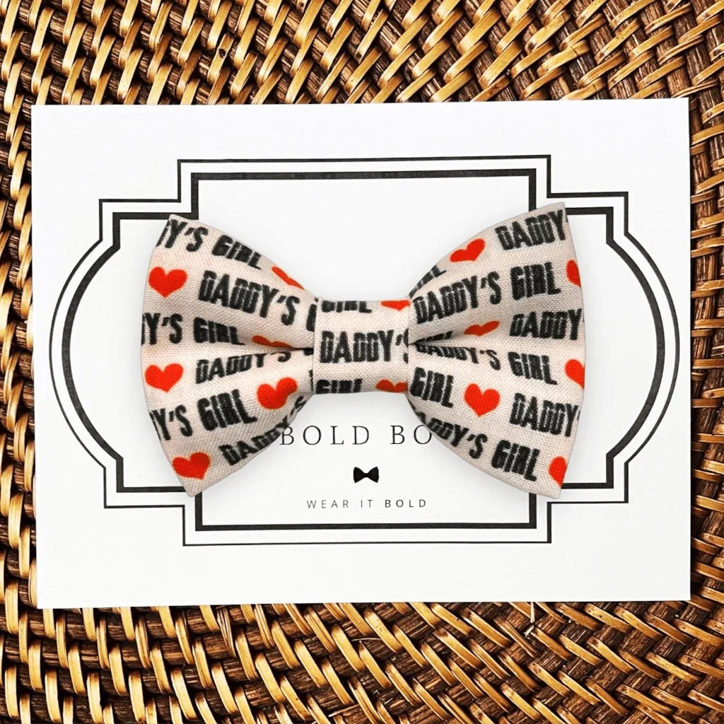 Dog bow tie size chart. Size Small is 3 1/2 inches wide for small dogs under 15 lbs. Size Medium is 4 inches wide for medium dogs between 15 band 40 lbs. Size Large is 4 1/2 inches wide for Large Dogs between 40 band 80 lbs. Size Extra Large is 5 1/2 inches wide for Extra Large Dogs over 80 lbs. Sizing is up to preference and pet bow ties slide on to dog collars with elastic.