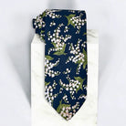 Navy blue and white floral men’s tie for wedding.
