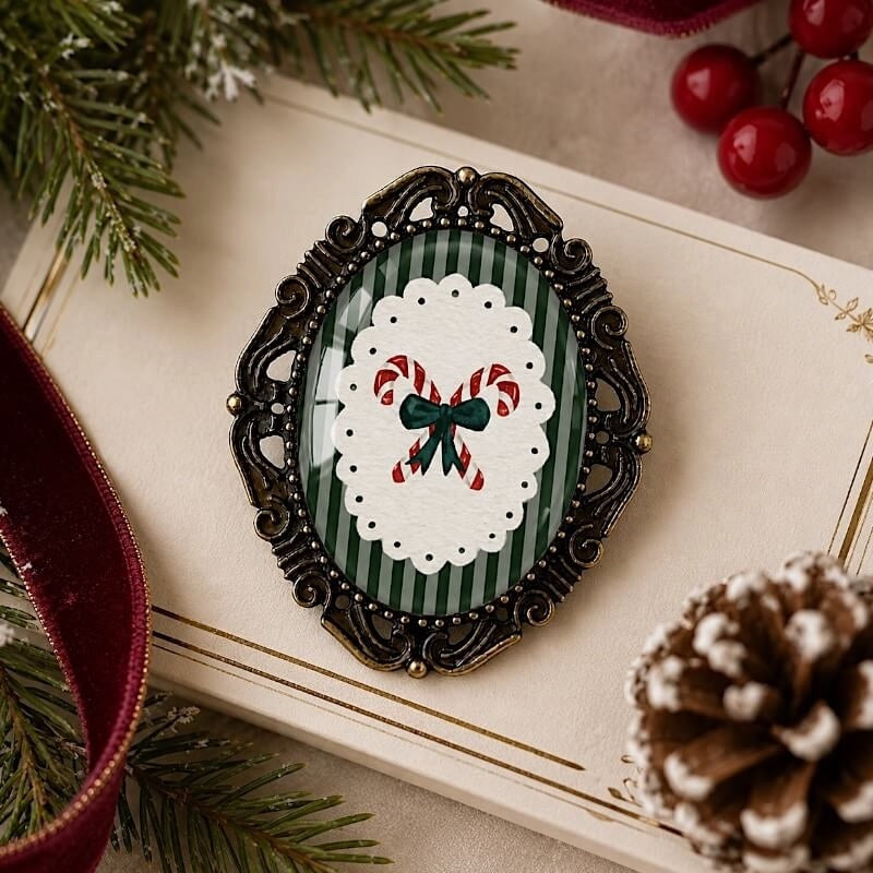 Vintage-style Christmas brooch with candy cane design, green stripes, and ornate frame, perfect for holiday outfits.