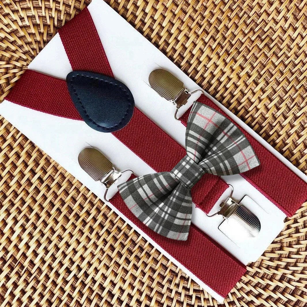 Gray plaid bowtie and suspenders on a woven tray for men and boys.